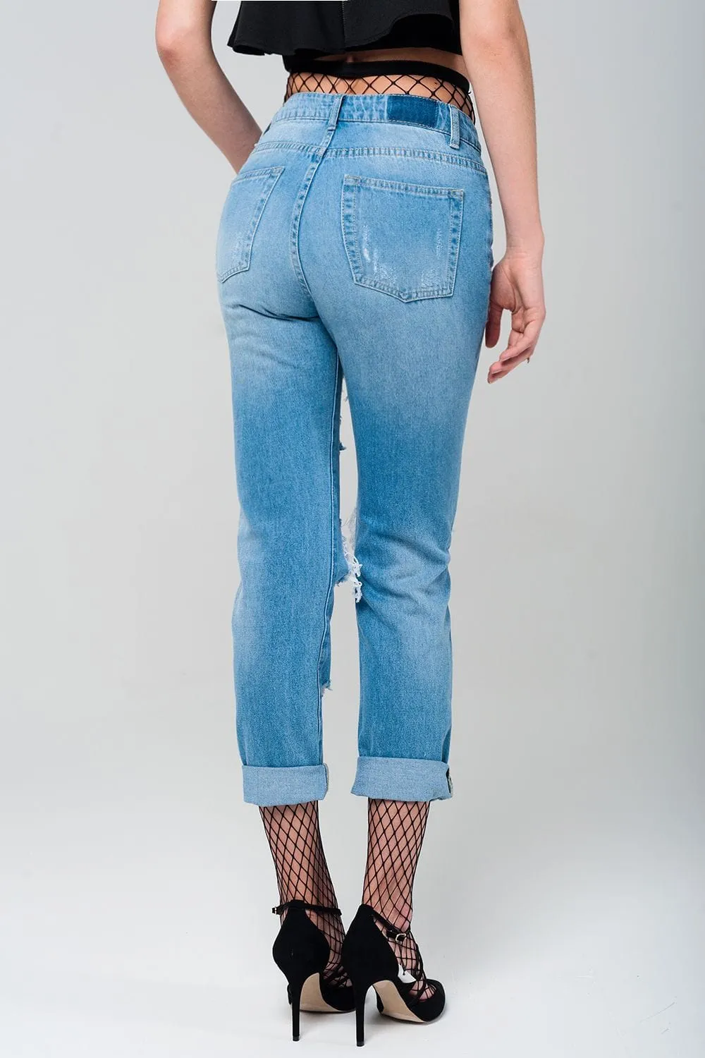 Ripped Mom Jeans With Fishnet Tights